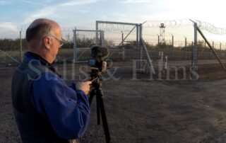 Filming a news report at the Hungarian border