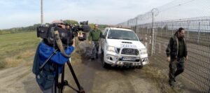 Filming a news report at the Hungarian border